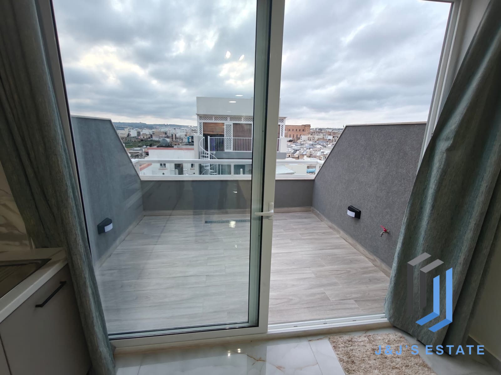 Fully furnished one-bedroom penthouse with city view in Hamrun · 4